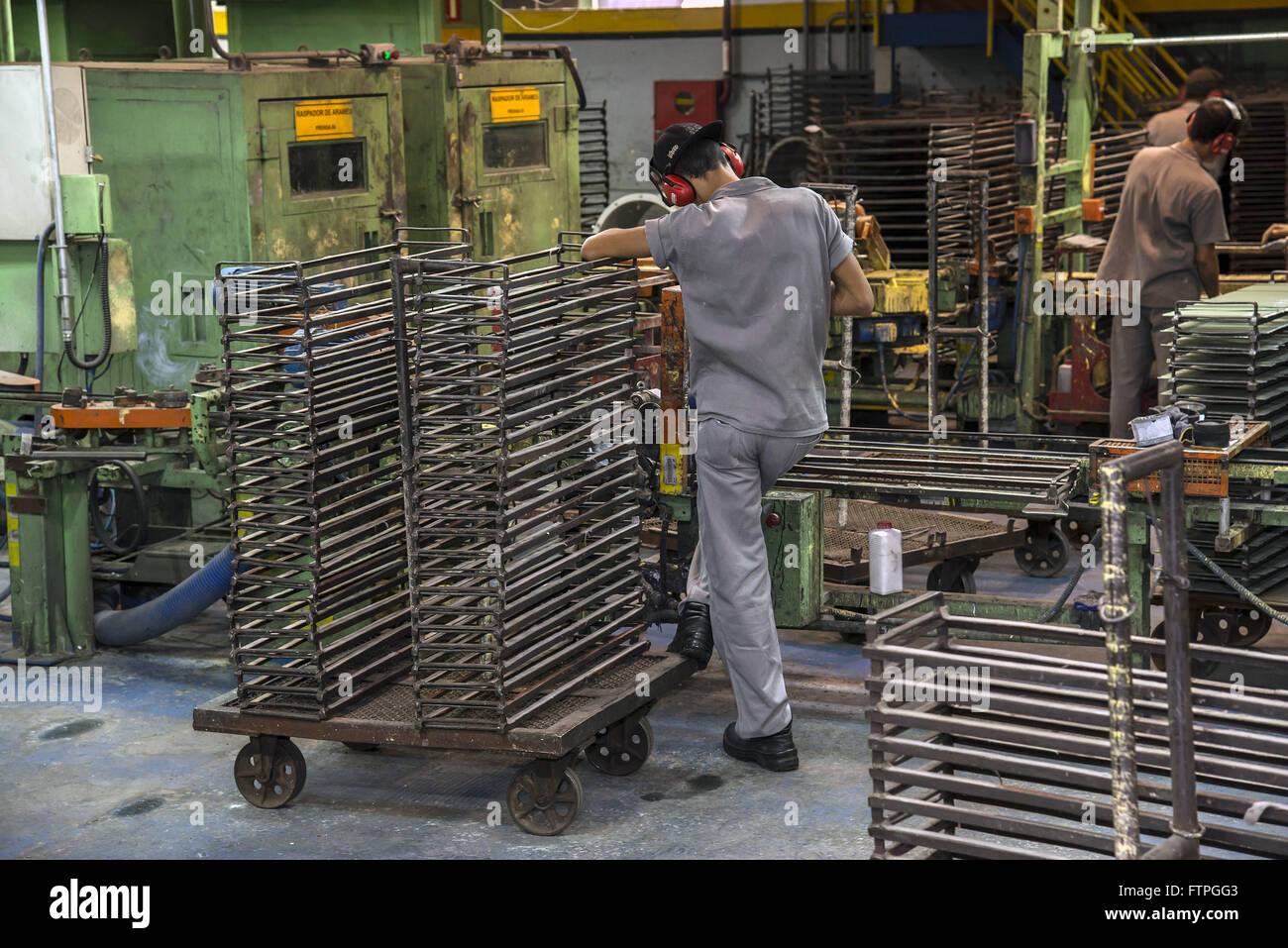 Workmen in manufactures of electrodes used for welding Stock Photo