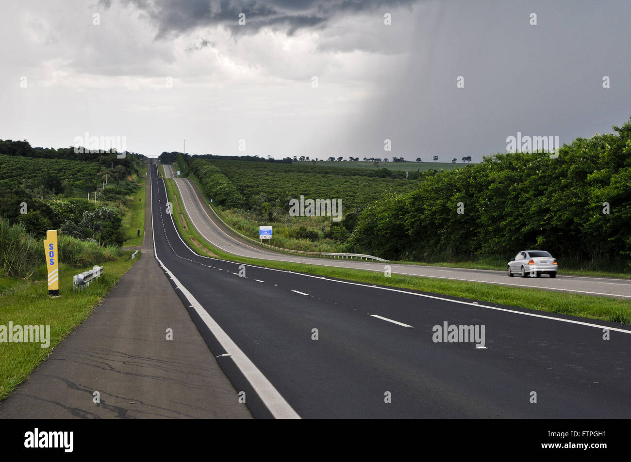 Automobile traveling on Highway SP-340 in rainy day Stock Photo