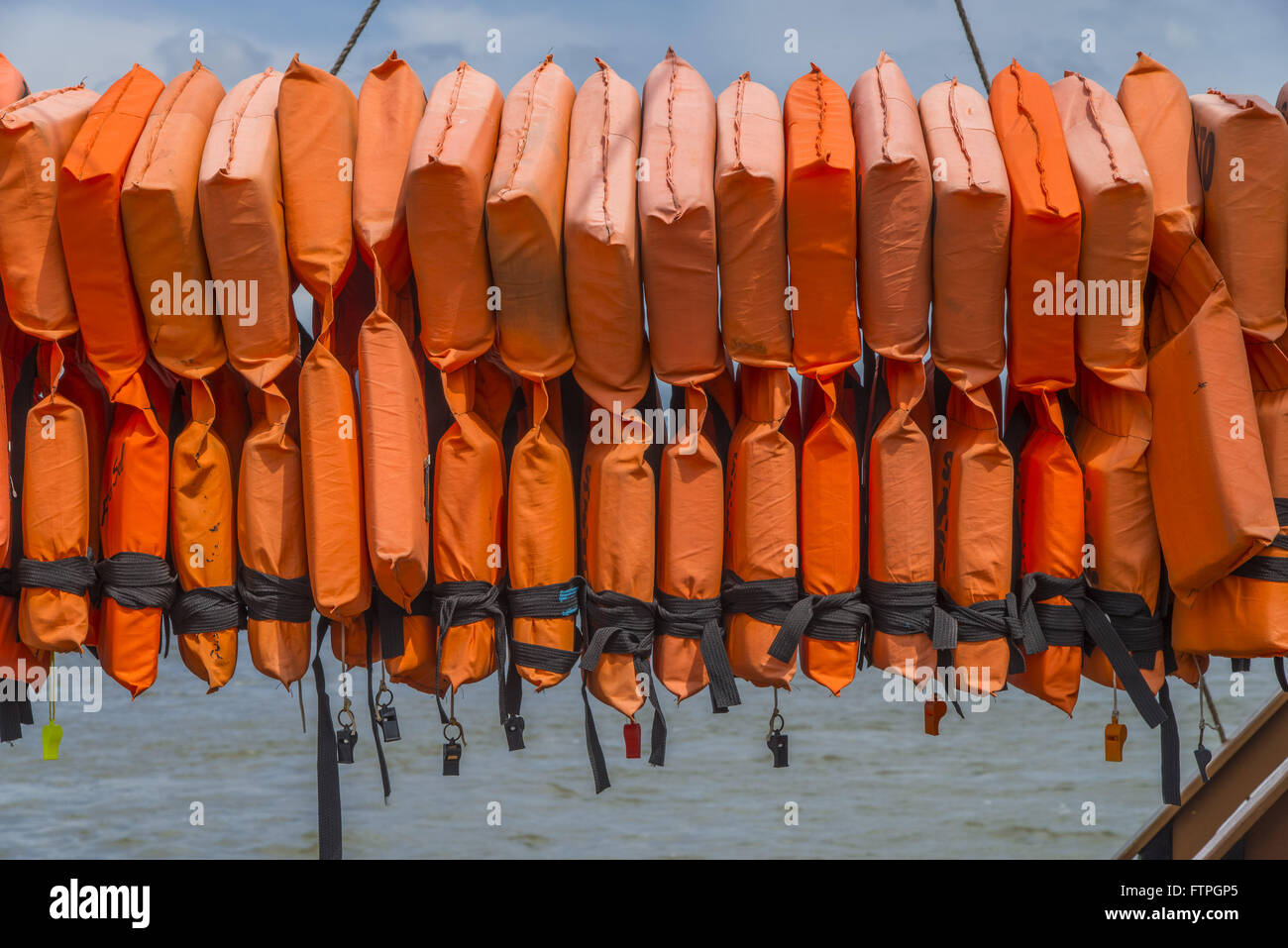 Detail of life jackets and whistles of tourist schooner anchored in the Bay pier Babitonga Stock Photo
