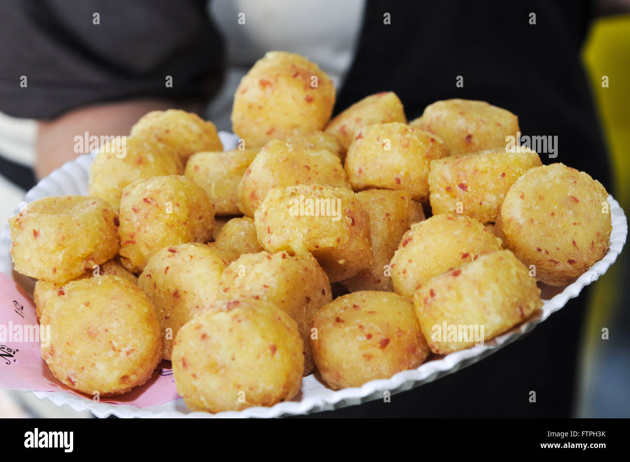 Cassava dumplings stuffed with smoked sausage sold on First Party Cassava Stock Photo