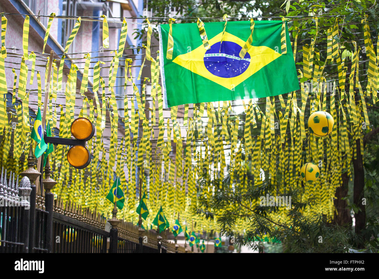 Rua Silveira flag and adorned with strips of colored paper for the World Cup 2014 Martins Stock Photo