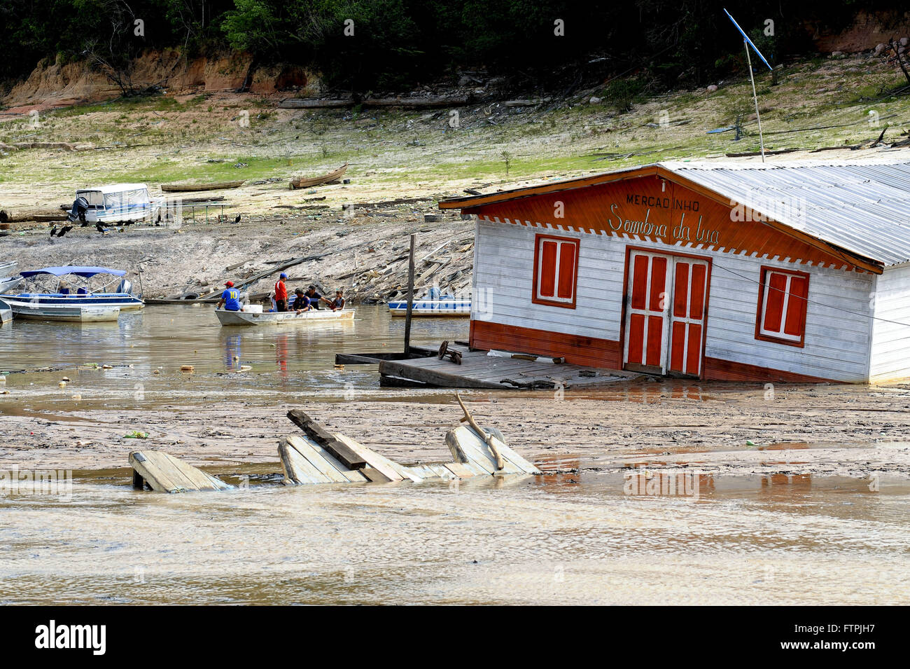 Houseboat beached David Marina due to drought in the Rio Negro Stock Photo