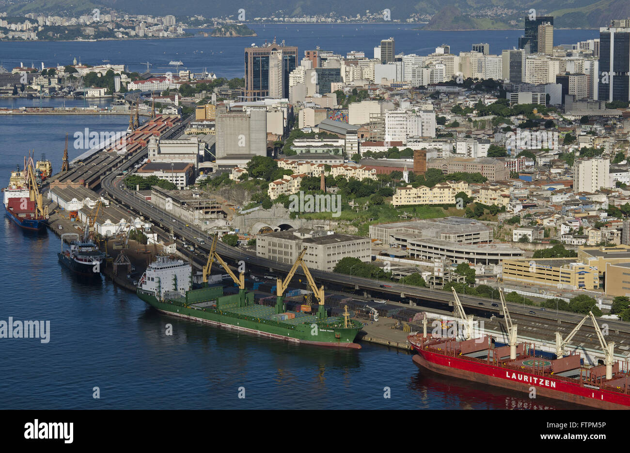 Aerial view of cargo ship in the port of Rio de Janeiro and Perimeter Avenue Stock Photo