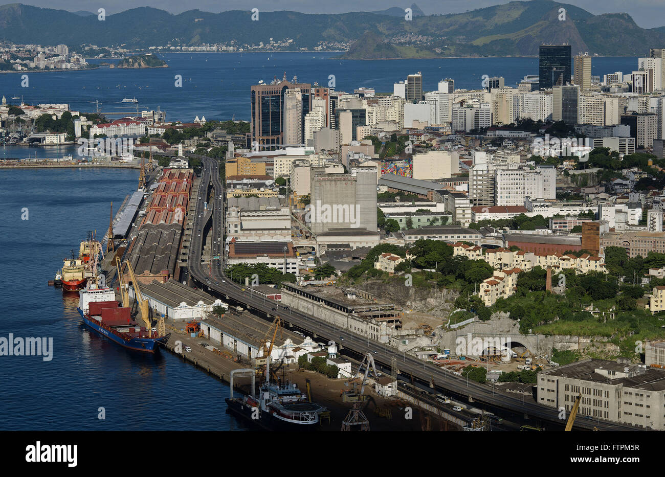 Aerial view of cargo ship in the port of Rio de Janeiro and Perimeter Avenue Stock Photo