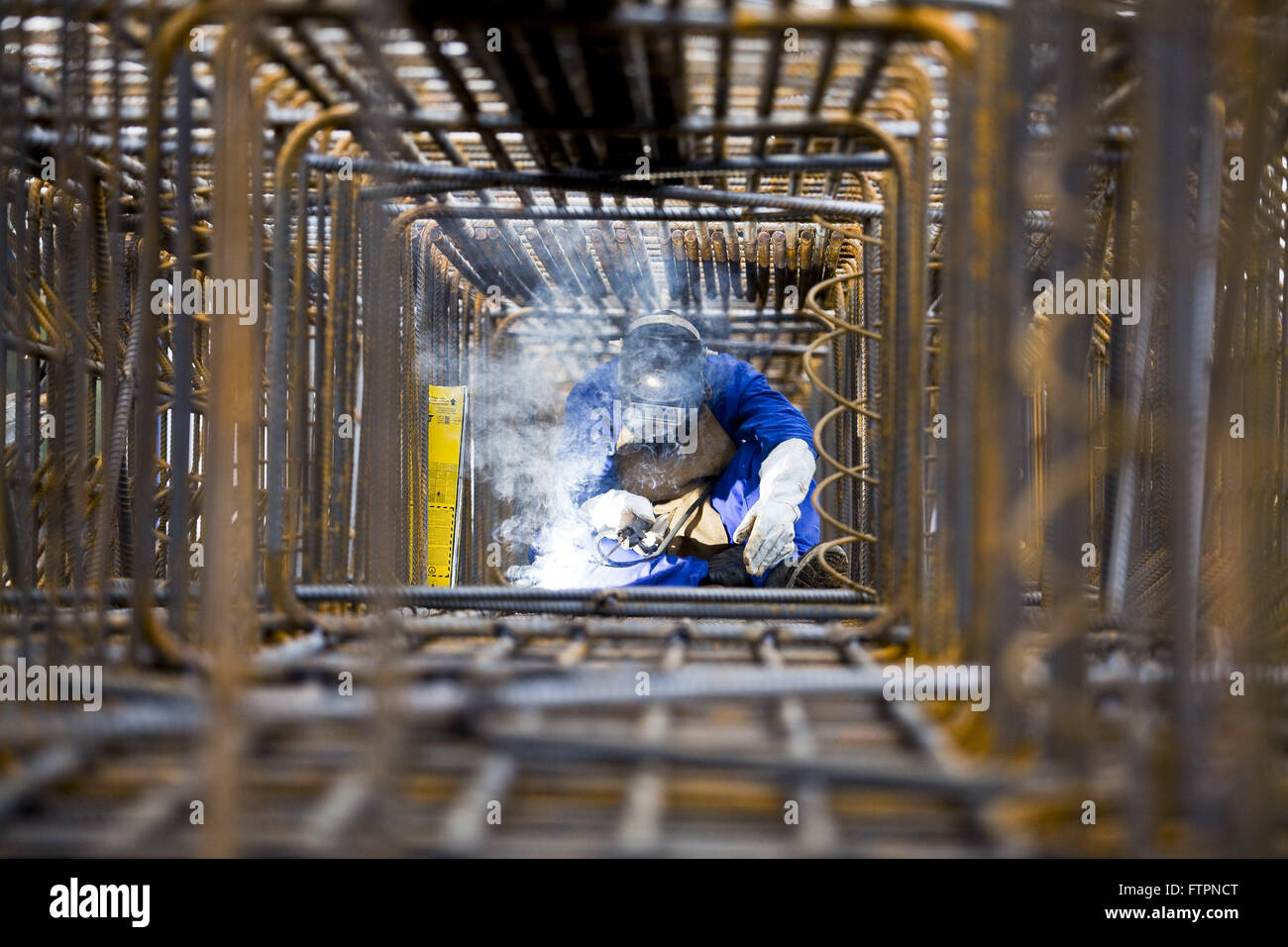 Laborer welding steel structure works in the railway Adolfo Pinheiro Metro Stock Photo