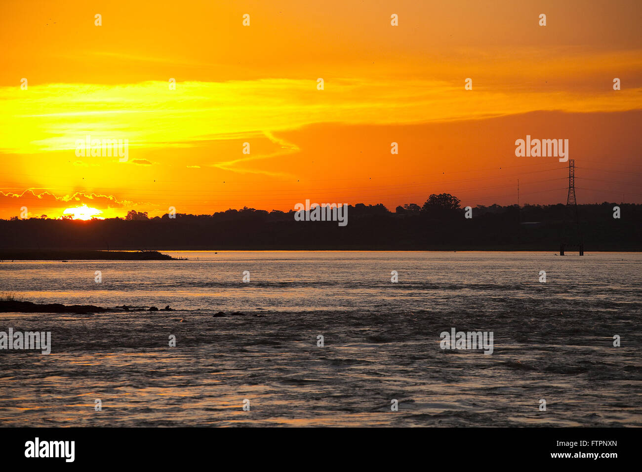 Sunset and rapids of the Rio Parana in period of drought Stock Photo