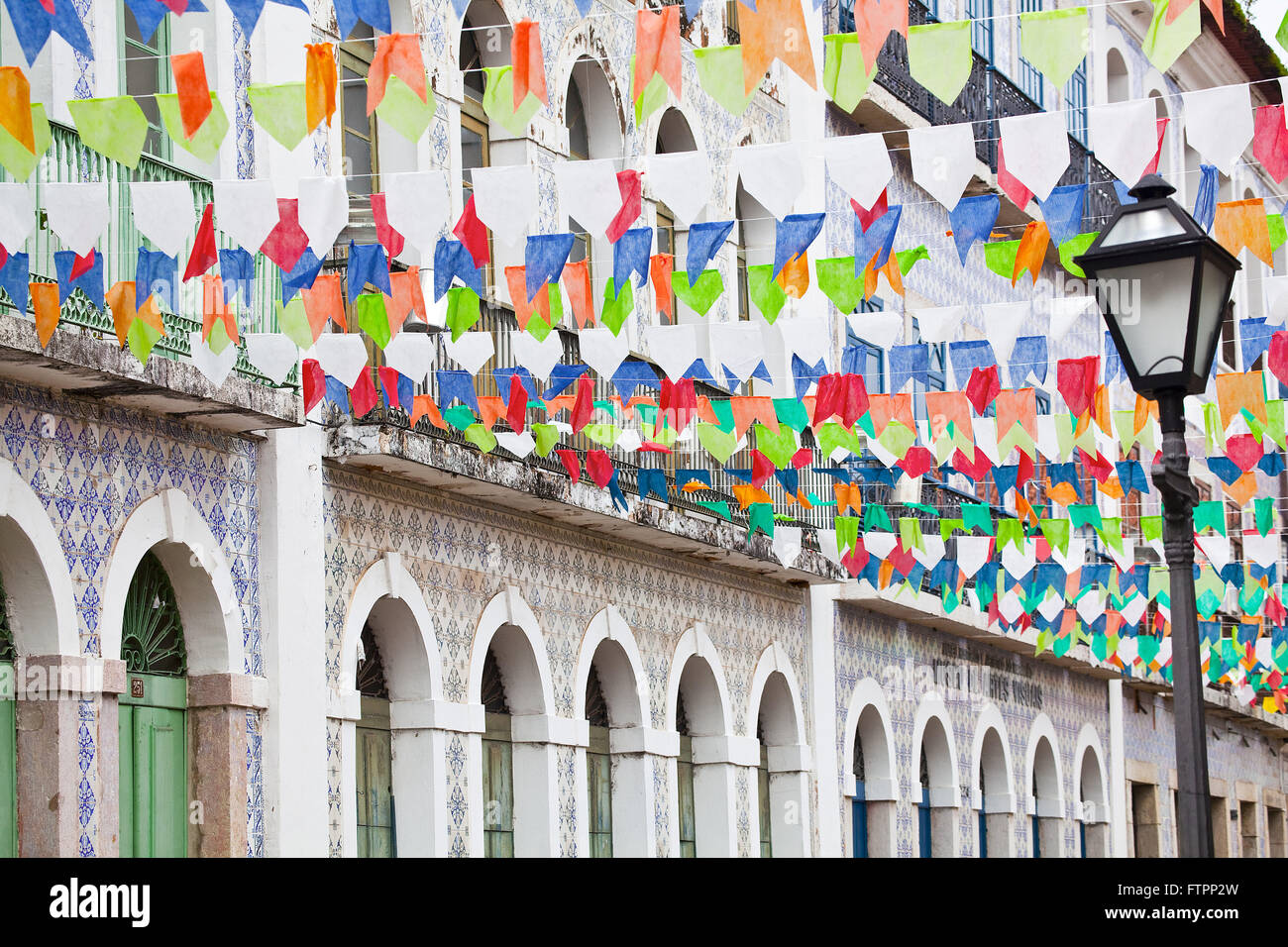 Historic center of the city festooned with colorful flags for June Party Stock Photo