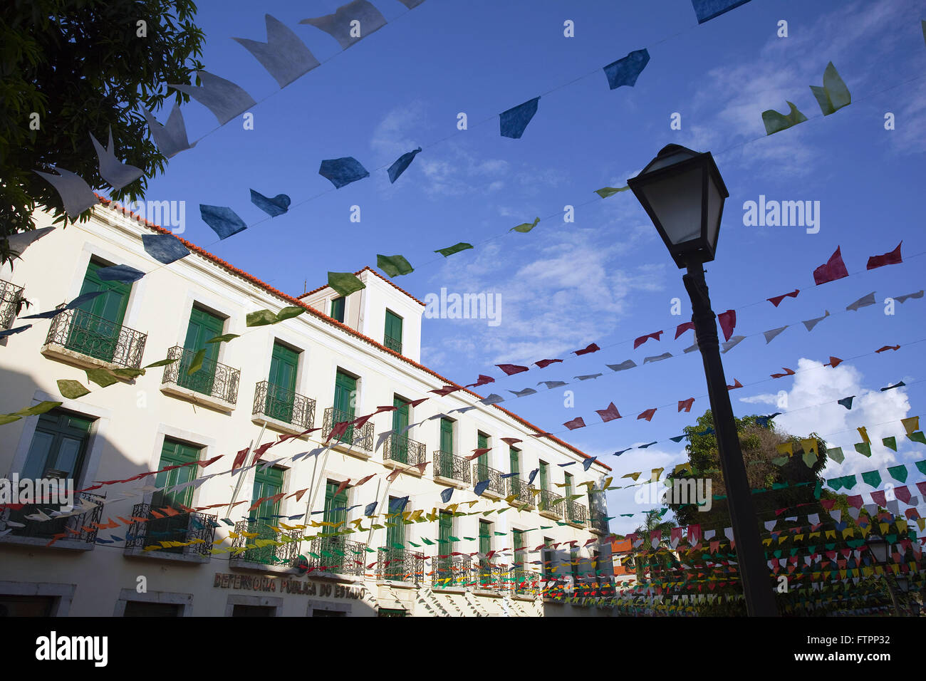 Historic center of the city festooned with colorful flags for June Party Stock Photo