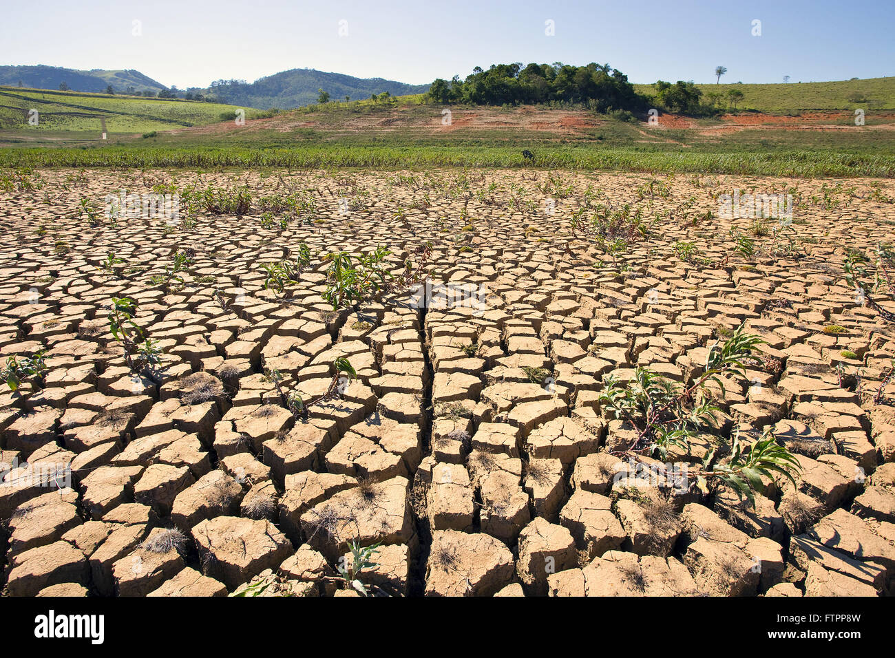 Cracked soil dam formed by Jaguari Jacarei Jacarei and rivers in severe drought period Stock Photo