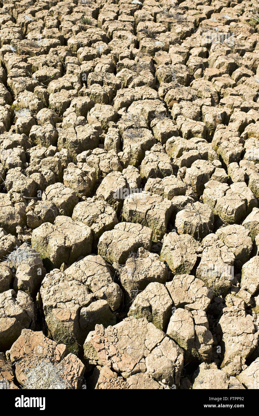 Cracked soil dam formed by the river Jaguari in severe drought period Stock Photo
