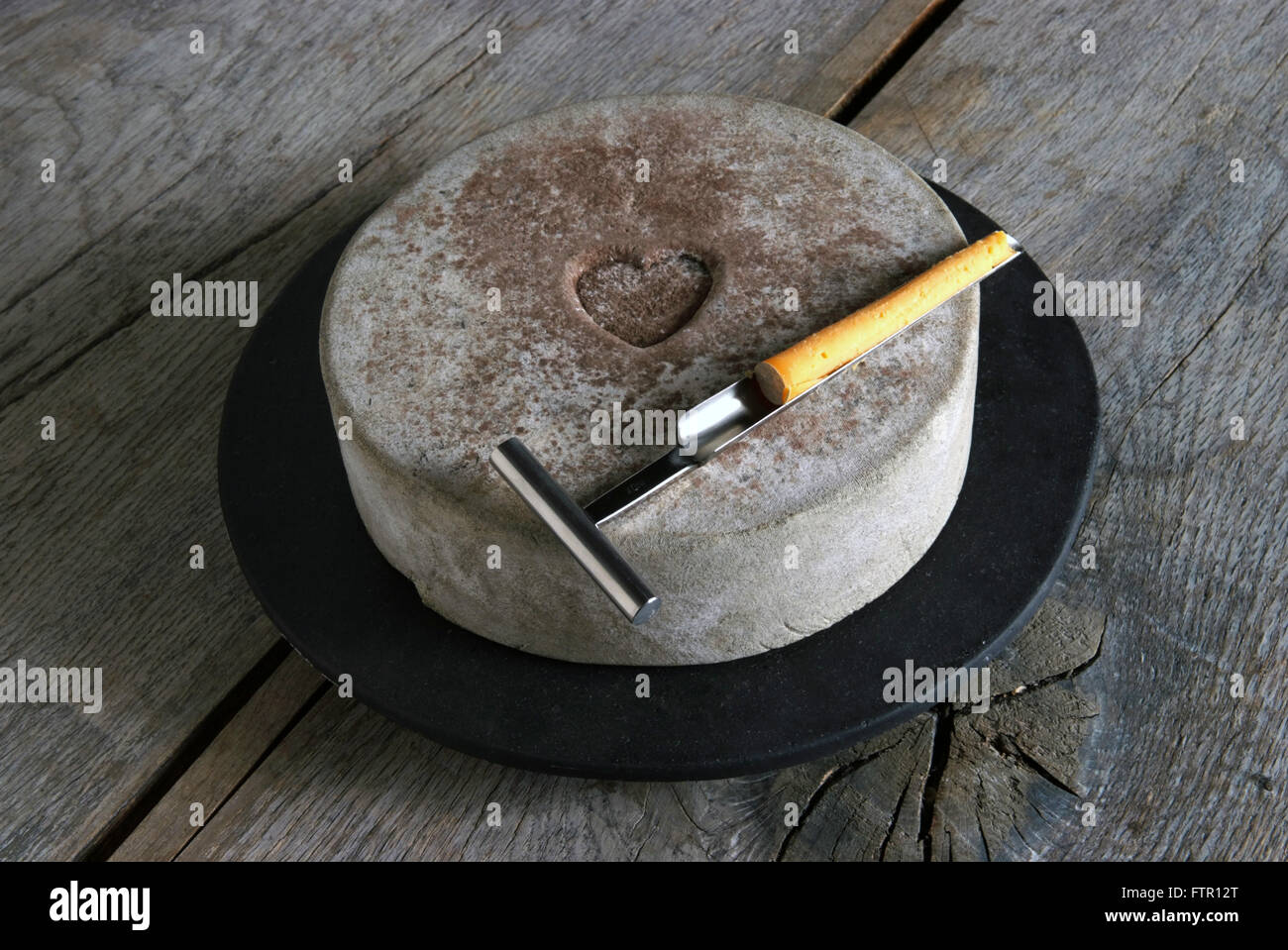 Daylesford Creamery cheesemaker James McCall with his Single Gloucester cheese in hand,with