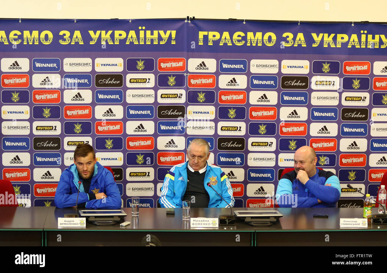 KYIV, UKRAINE - MARCH 27, 2016: Press-conference of the Ukraine National Team head coach Mykhaylo Fomenko (C) and forward Andriy Yarmolenko (L) before friendly game against Wales Stock Photo