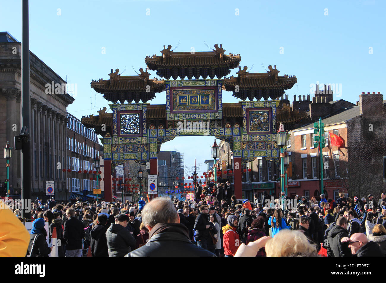 Chinese New Year parade, looking towards the Chinese arch Liverpool down Nelson street Stock Photo