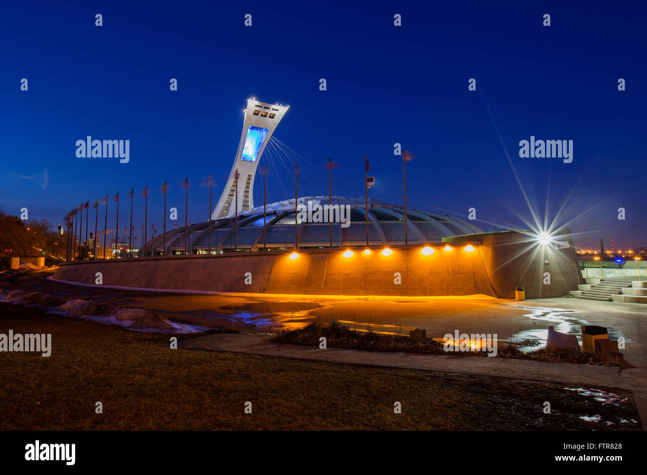 Blue hour at Olympic Stadium city Montreal Canada reflected in a water