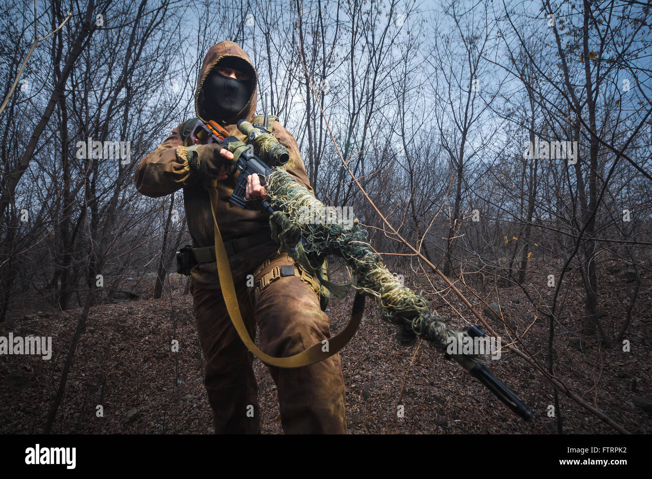 Sniper in Camouflaged Suit with Rifle Stock Image - Image of