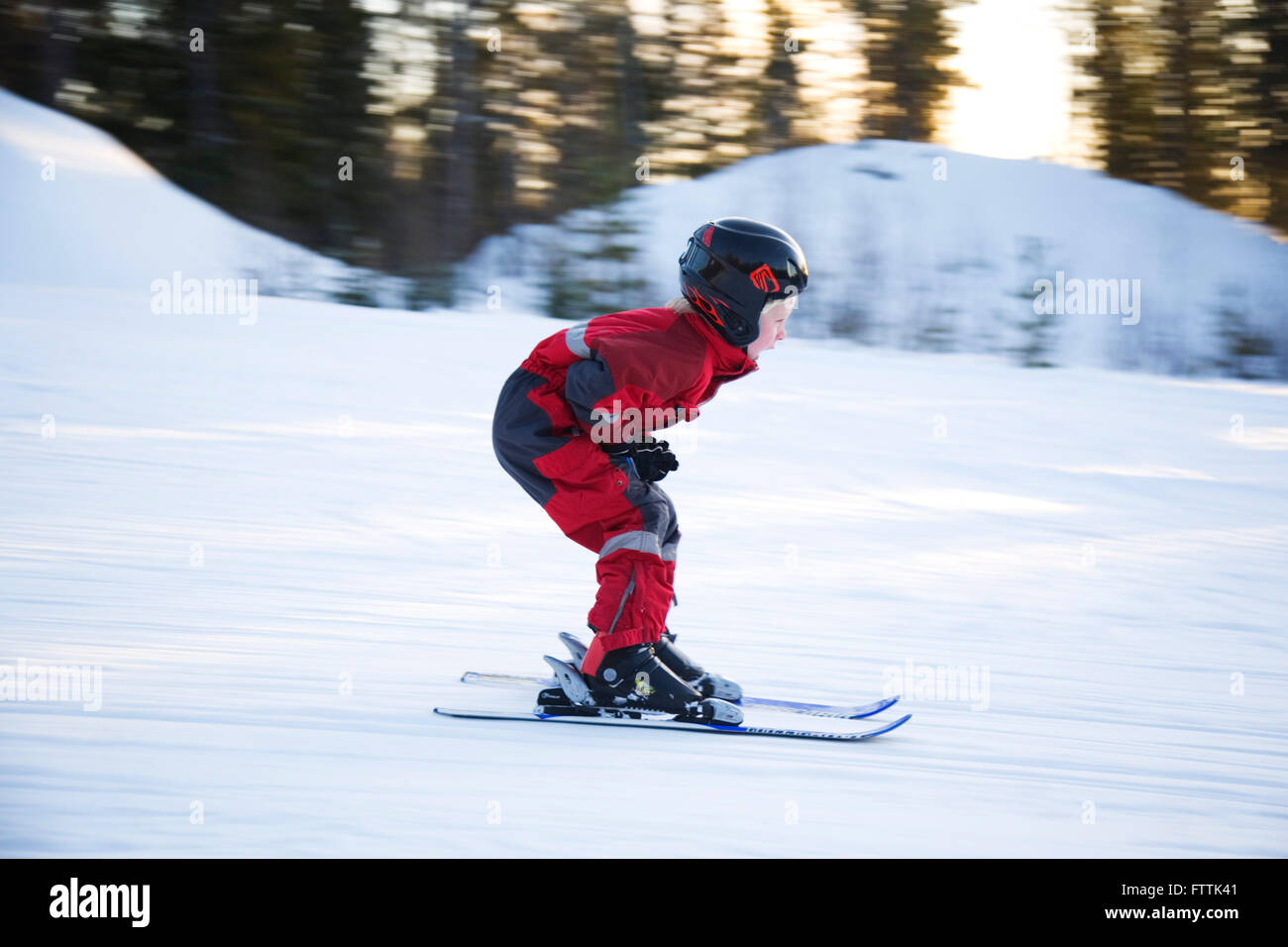 A five years old boy skiing downhill Stock Photo Alamy