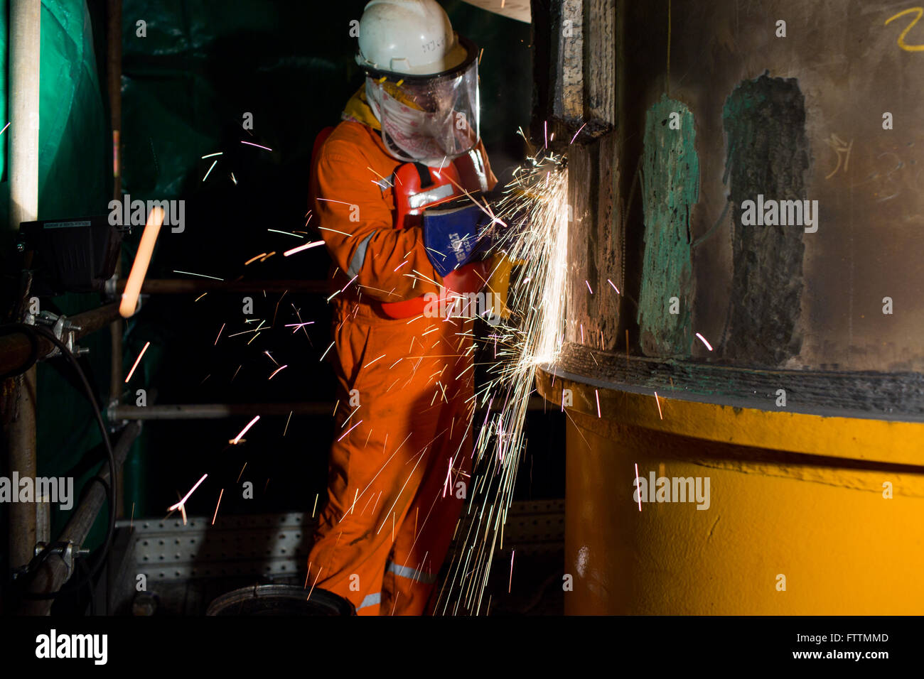 Man welding on oil rig Stock Photo