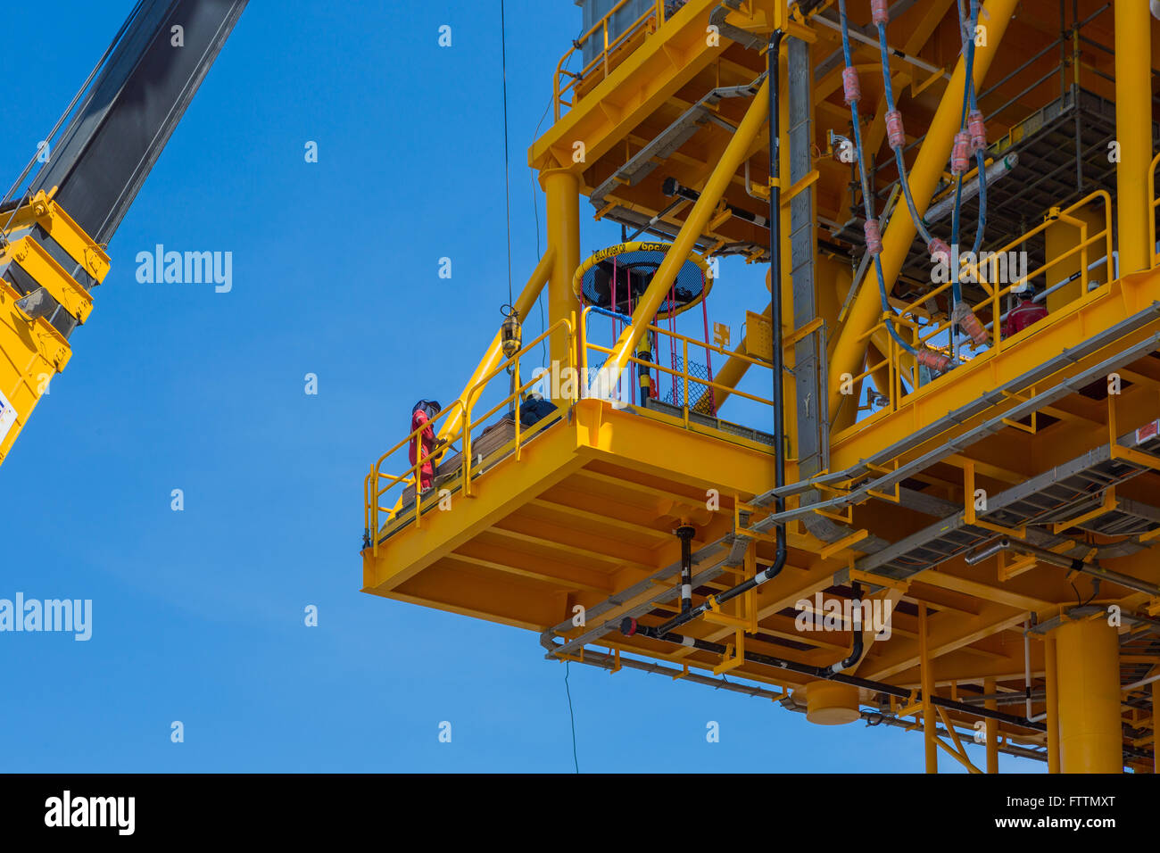 Closeup on man working on an oil rig Stock Photo