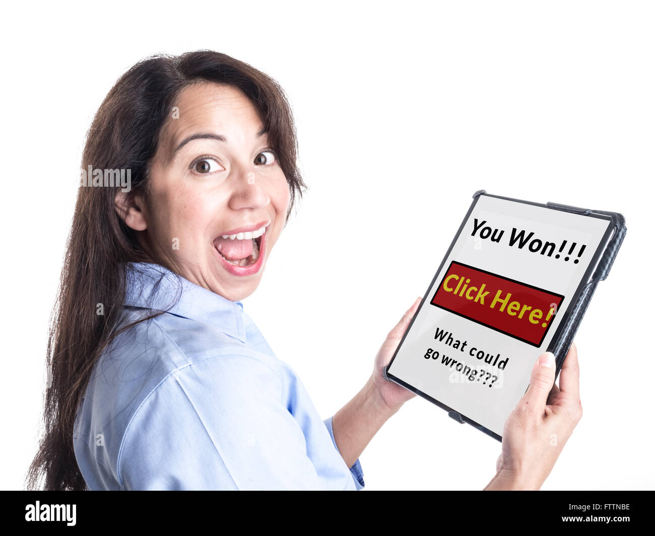 A young woman is overjoyed by message on her tablet computer stating she has won a prize, not realizing it is a scam. Stock Photo