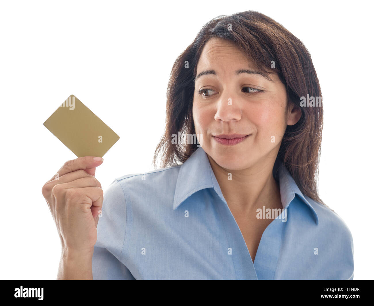 A young mixed race woman has second thoughts about a credit card or gift card. Stock Photo