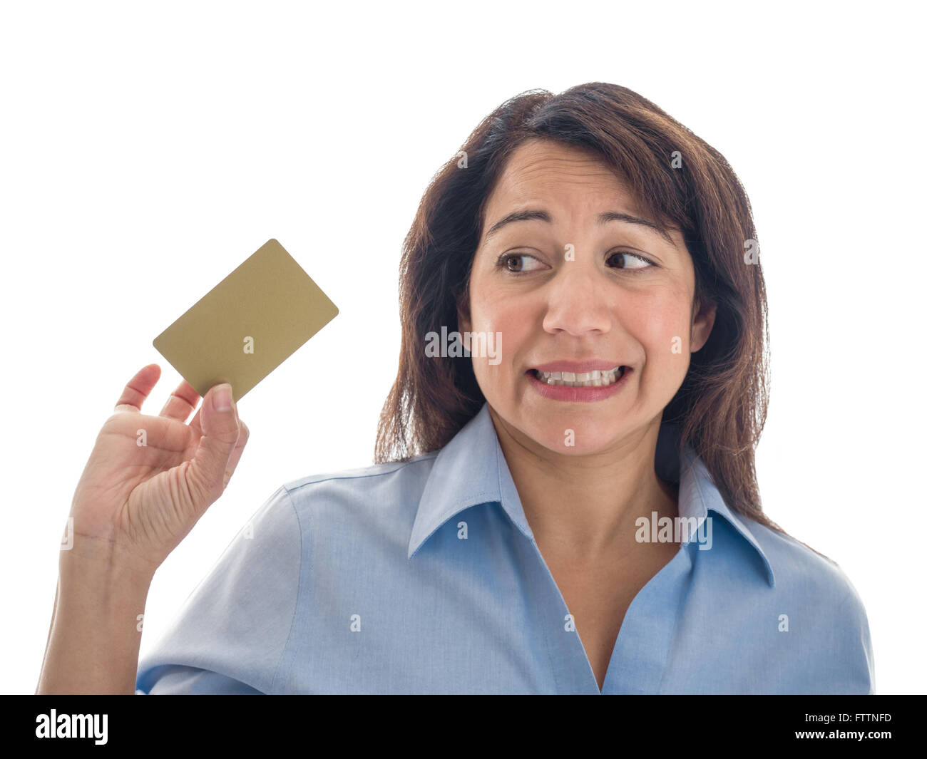 A young mixed race woman has misgivings about a credit card or gift card. Stock Photo