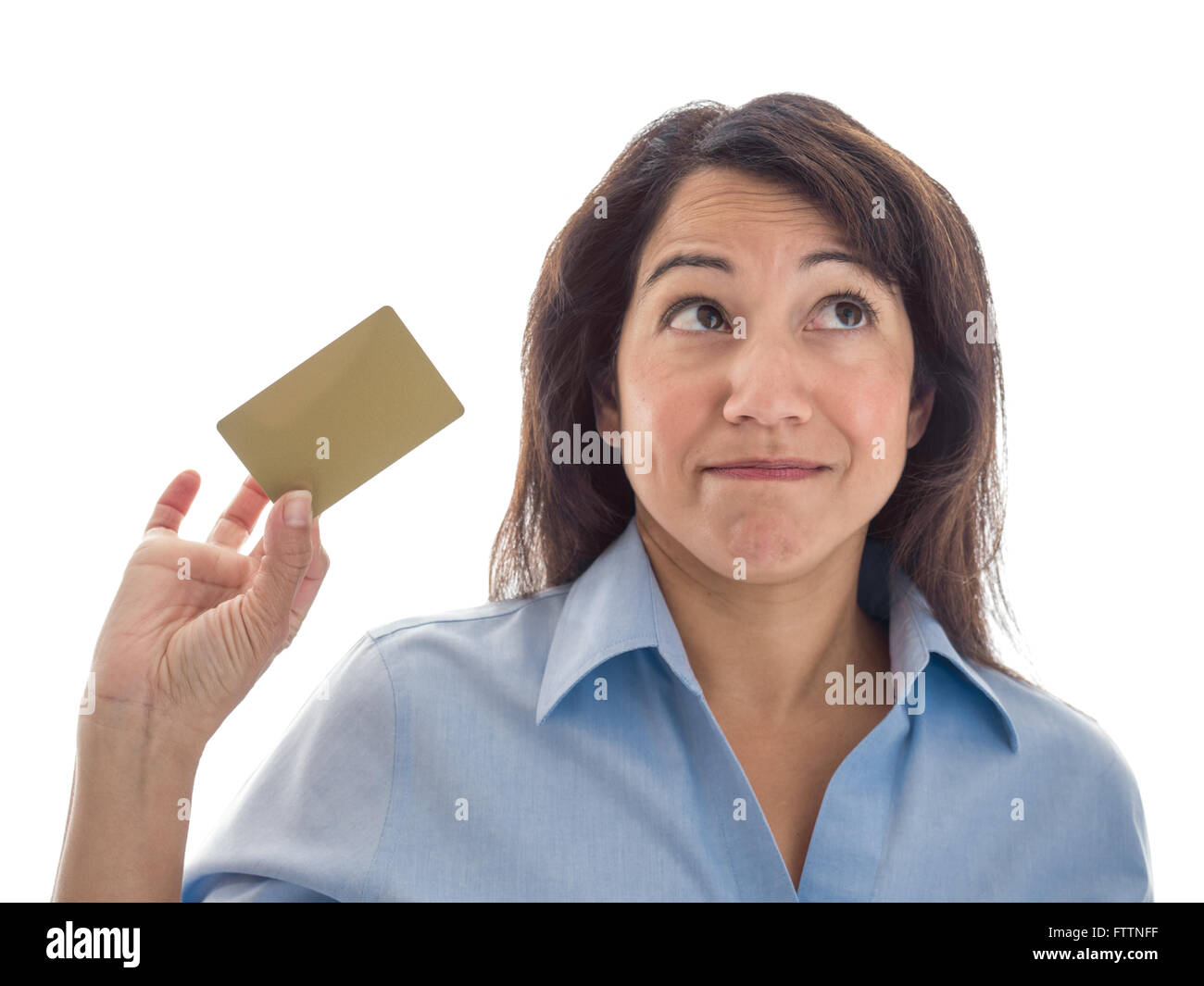 A young mixed race woman is considering what to do with a credit card or gift card. Stock Photo