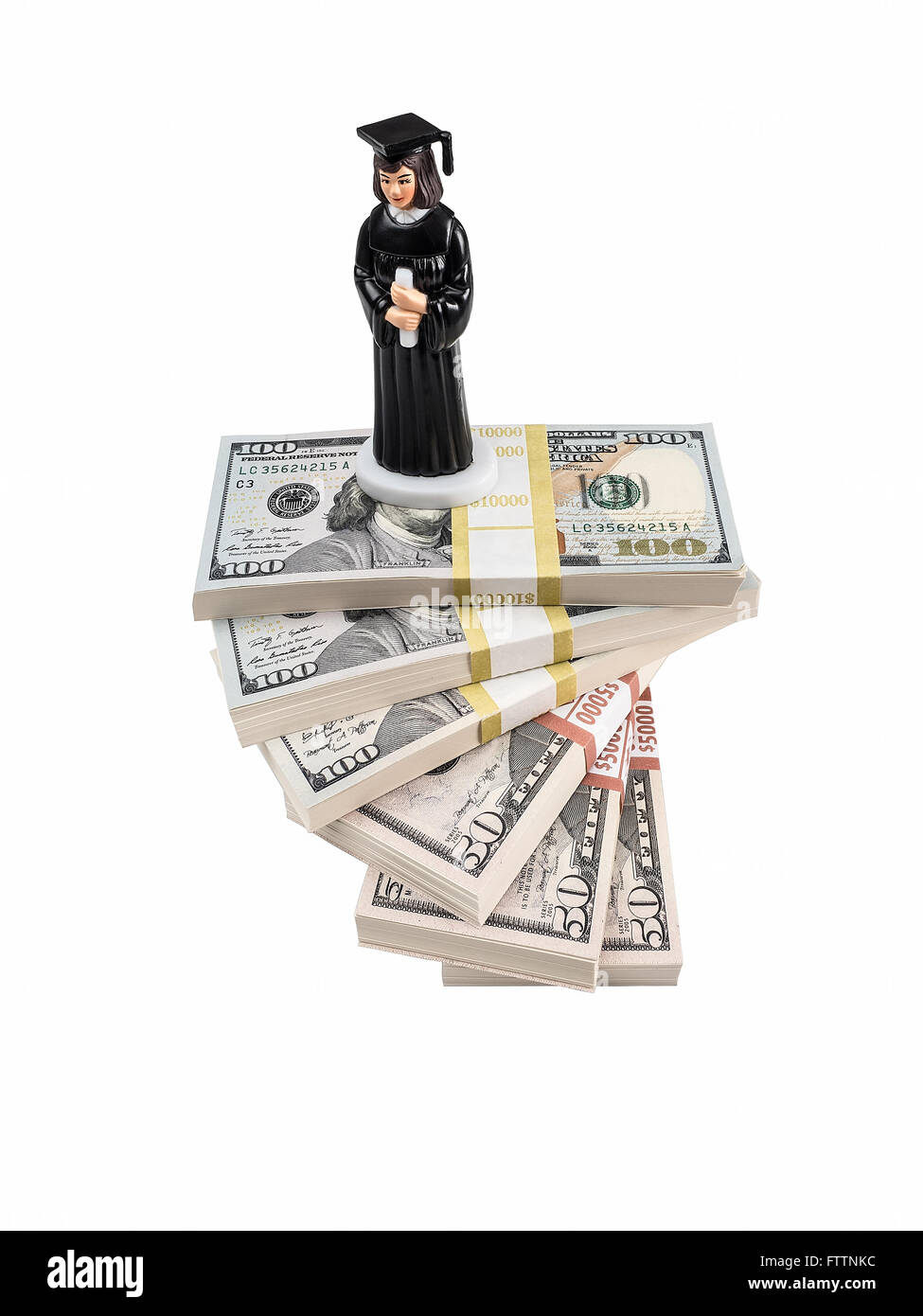 Photograph of a female graduate figurine in cap and gown, holding a