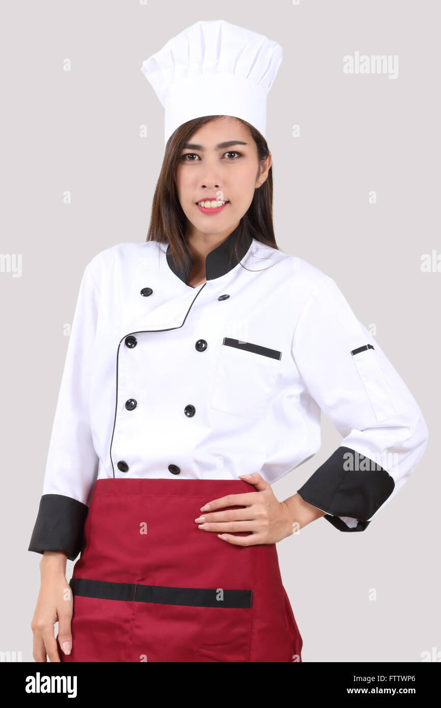 young woman chef in uniform with white hat Stock Photo Alamy