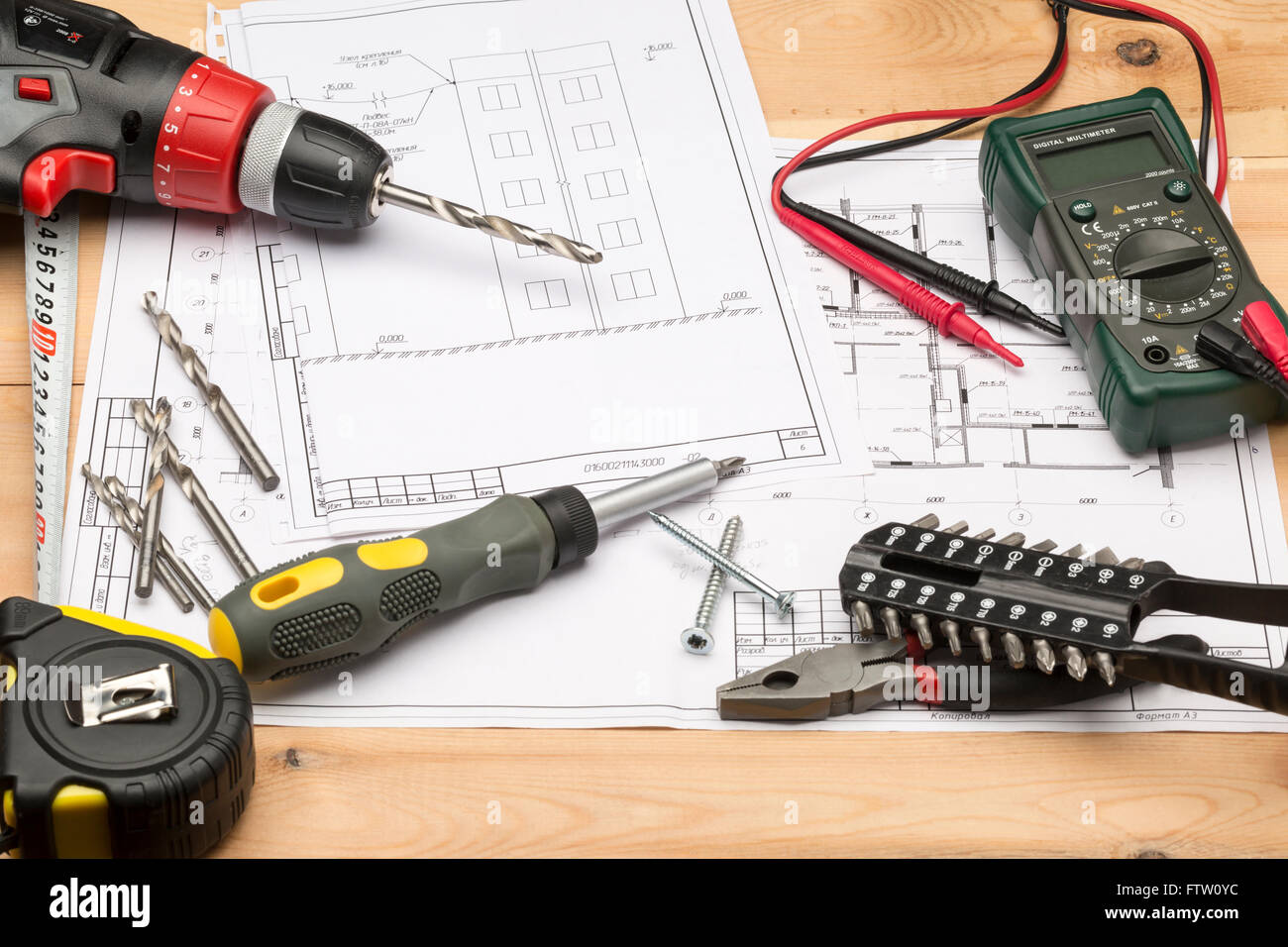 Set of different tools for repair and construction: multimeter, screwdriver, screws, project, wrench, hand tool Stock Photo