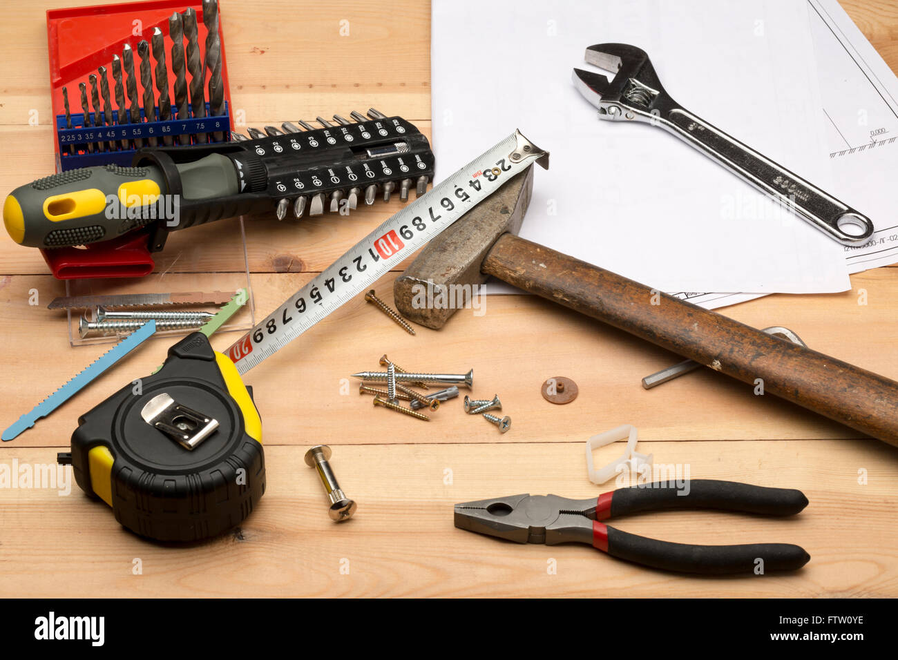 Set of different tools for repair and construction: hammer,pliers,screwdriver,screws,drill set,tape measure,wrench,hand tool Stock Photo