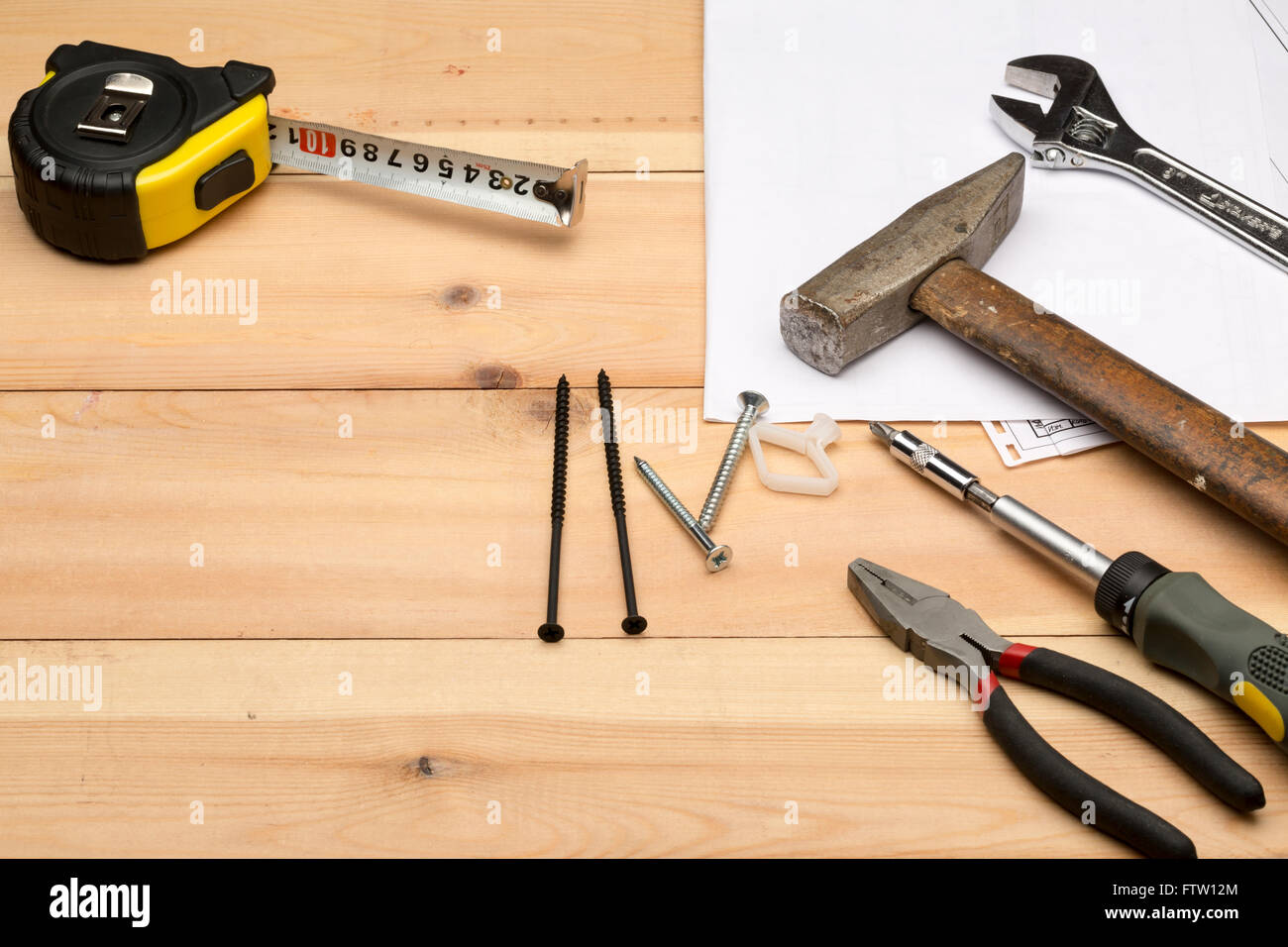 Set of different tools for repair and construction: hammer,screwdriver,screws,meter,wrench,hand tool Stock Photo