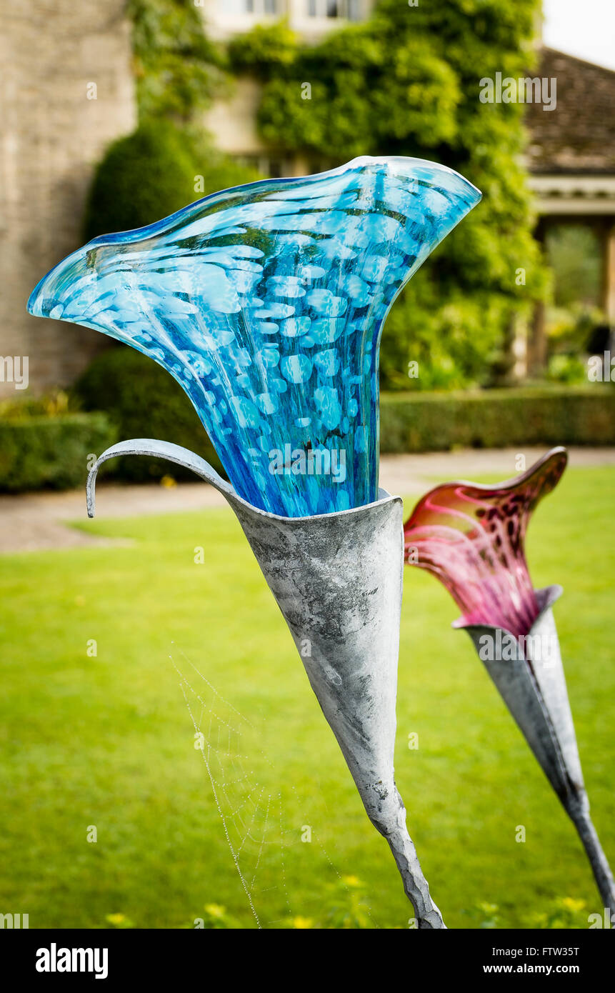 Unique metal and glass garden sculpture featuring lilies by Jenny Pickford Stock Photo