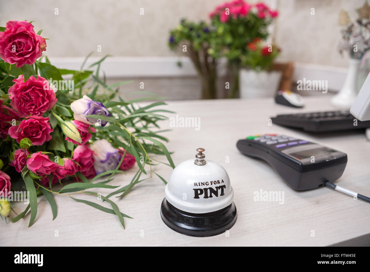 Counter and terminal at flower shop. accessories on table Stock Photo