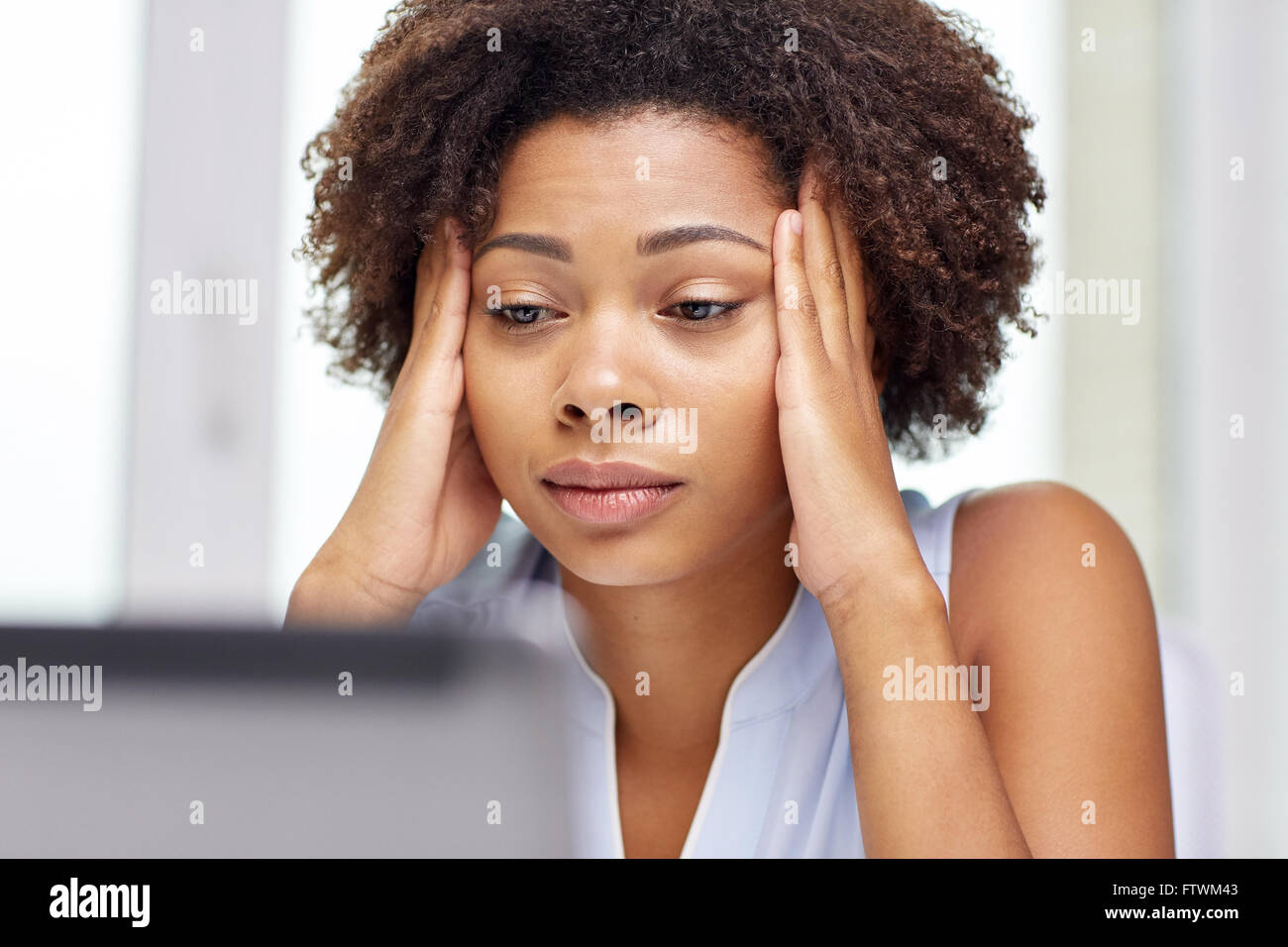 african woman with laptop at office Stock Photo - Alamy