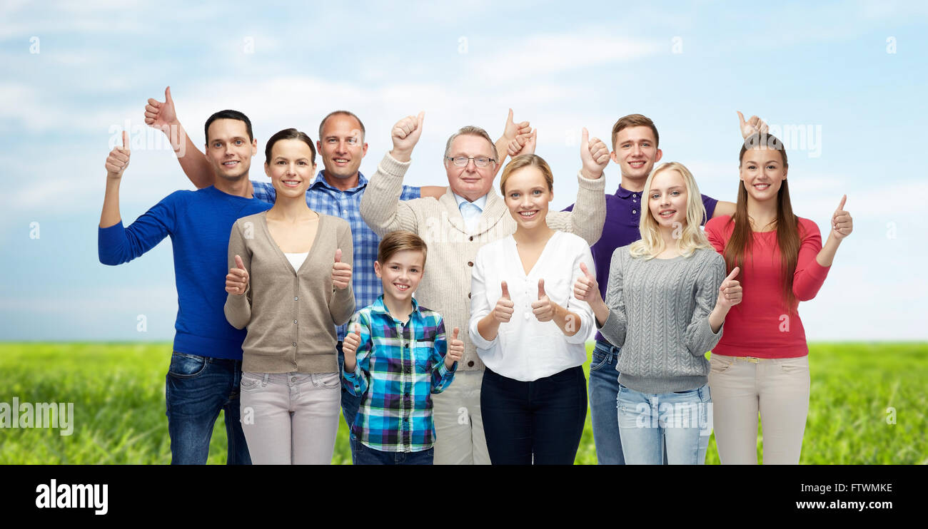 group of smiling people showing thumbs up Stock Photo - Alamy