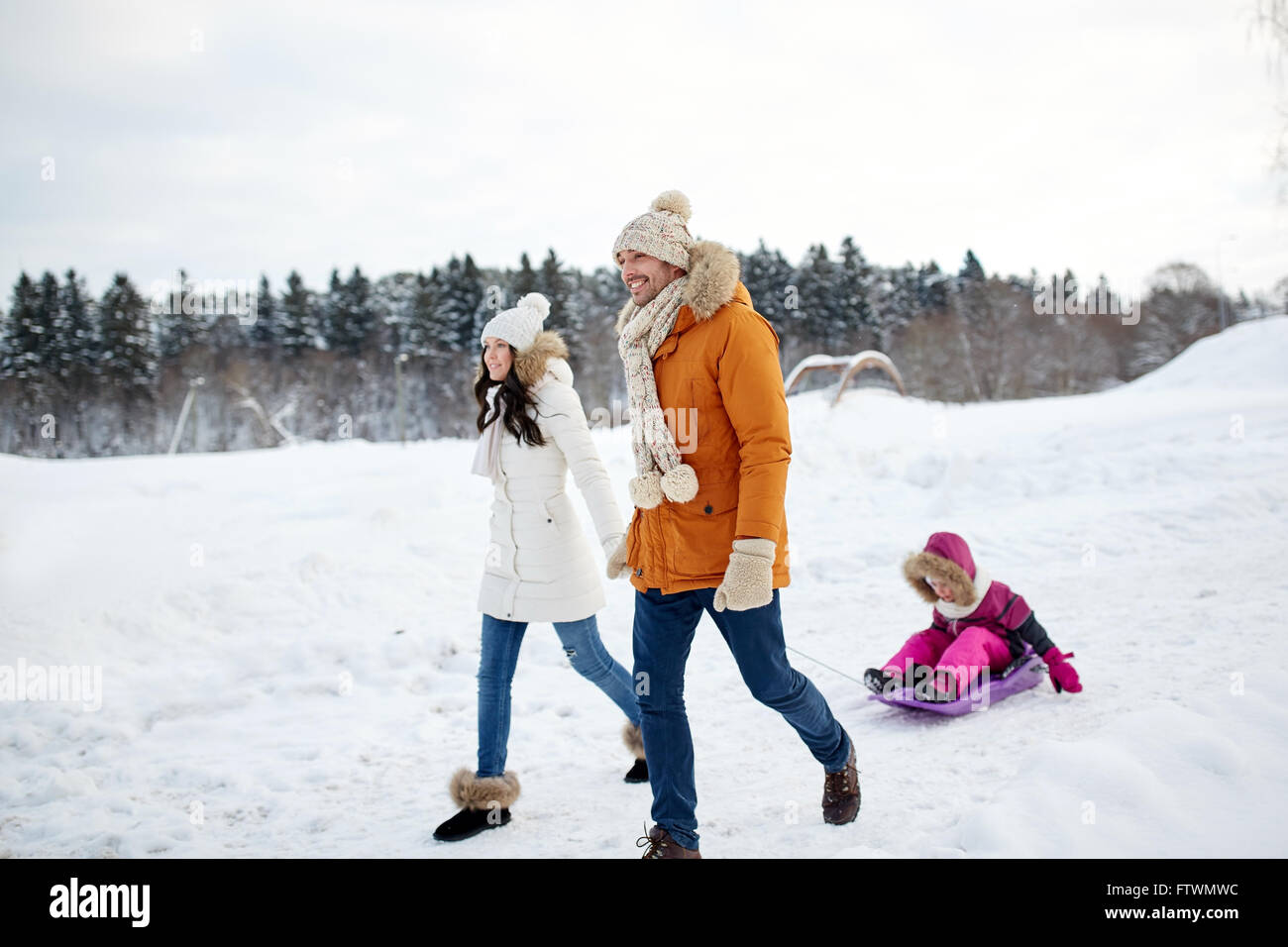 happy family with sled walking in winter outdoors Stock Photo - Alamy