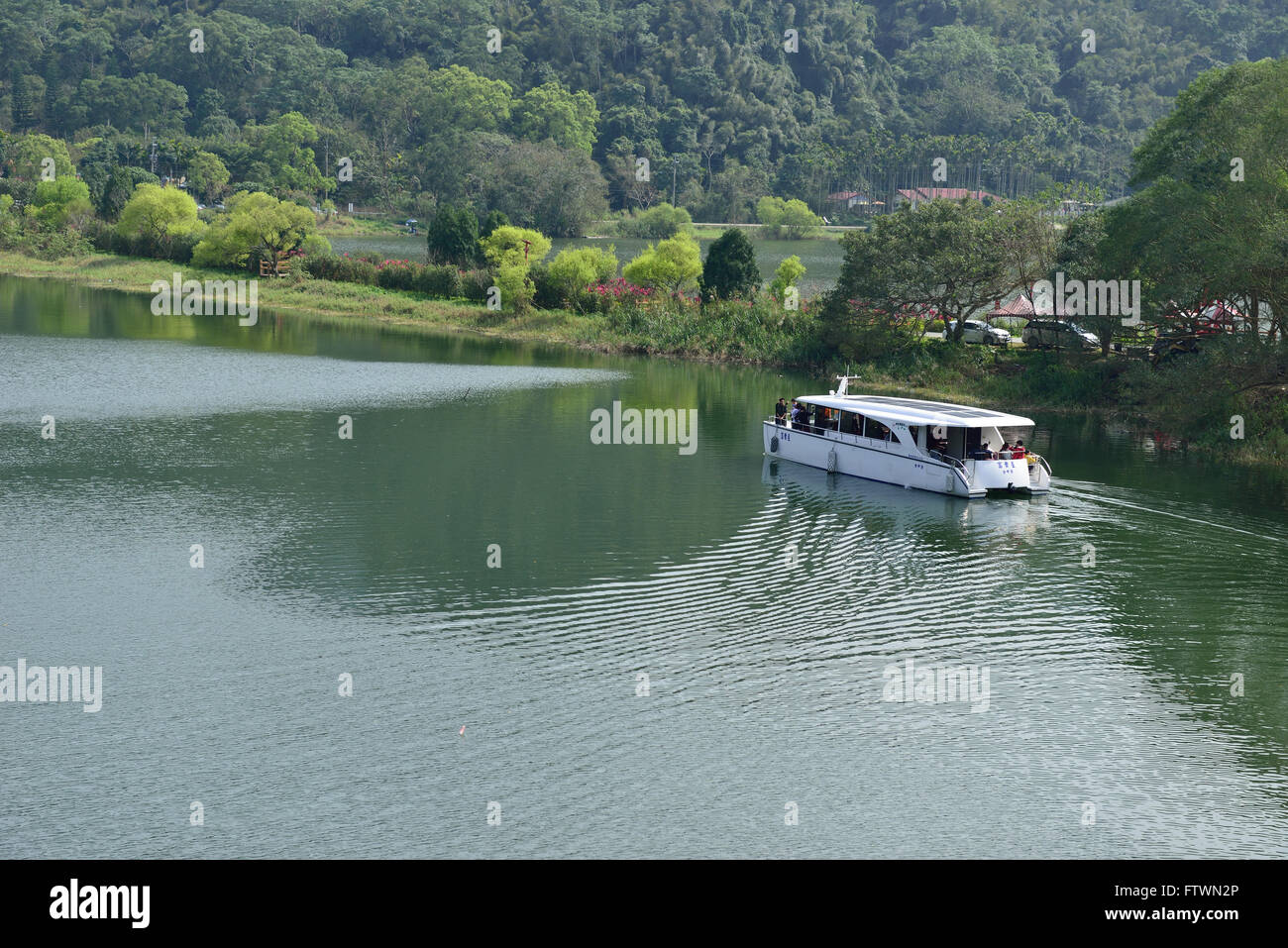 A boat crossing the lake Stock Photo Alamy