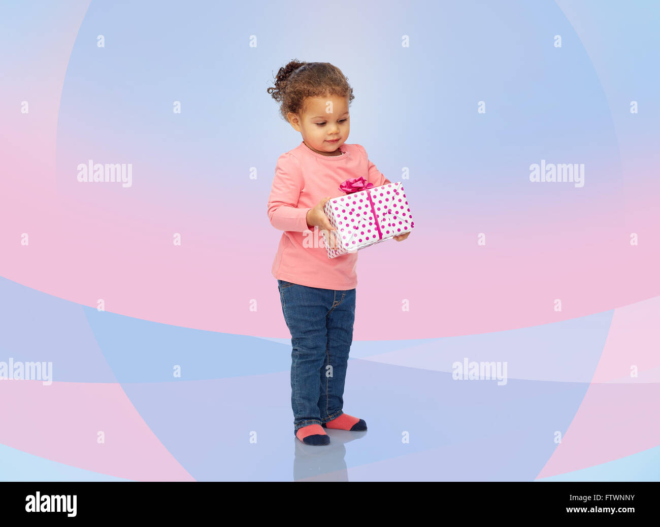 beautiful little baby girl with birthday present Stock Photo - Alamy