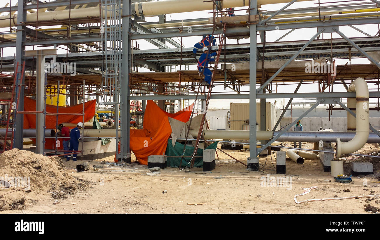 Men working on construction of oil and gas processing plant in Egypt. Stock Photo