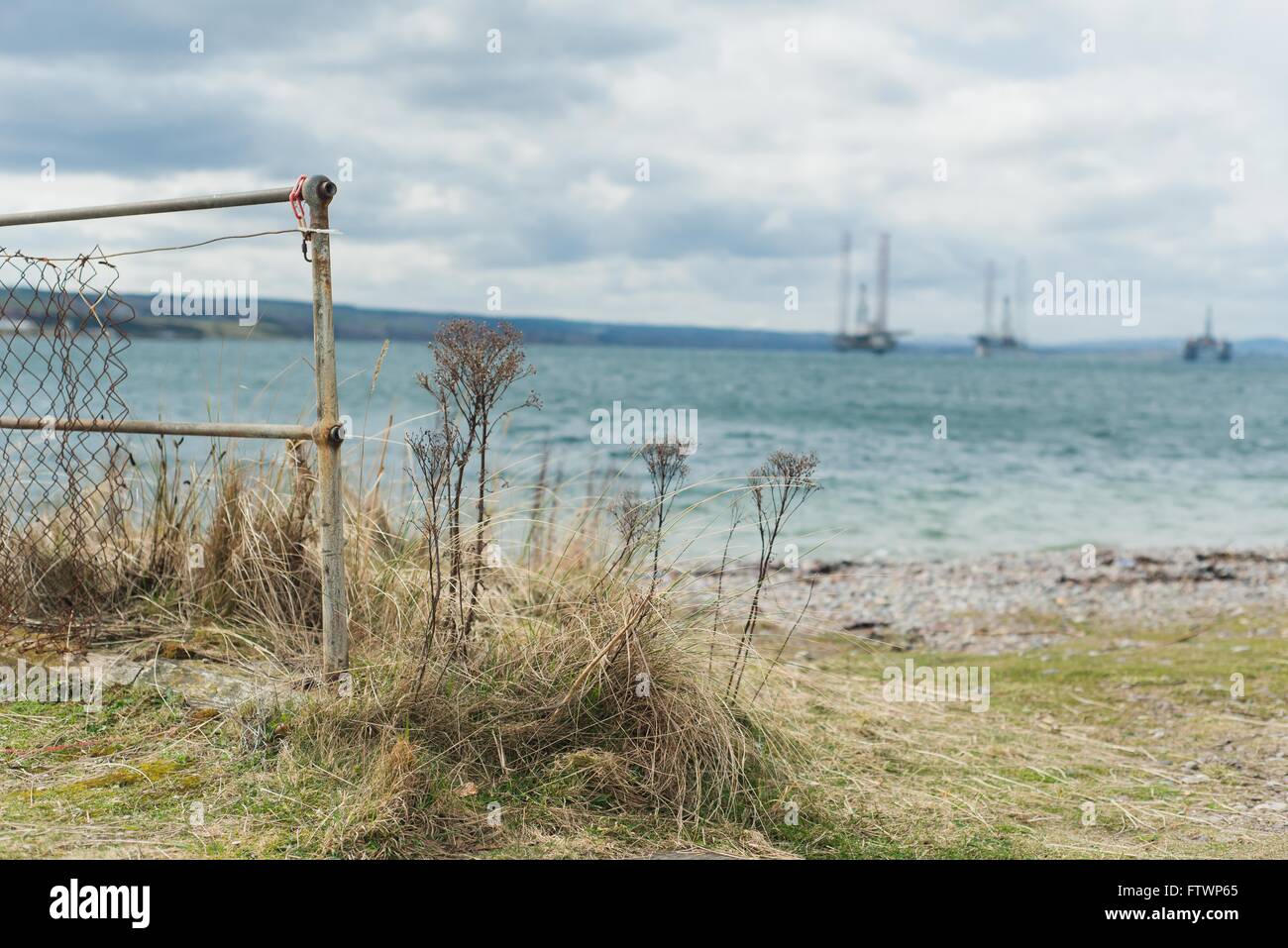 Cromarty Firth, oil rigs in distance out of focus Stock Photo