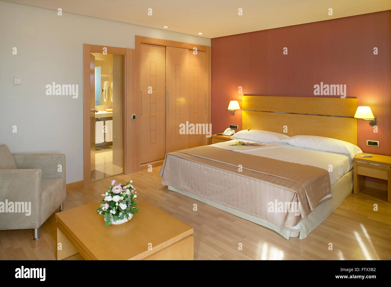 Hotel bedroom interior in warm tone. Horizontal format Stock Photo - Alamy