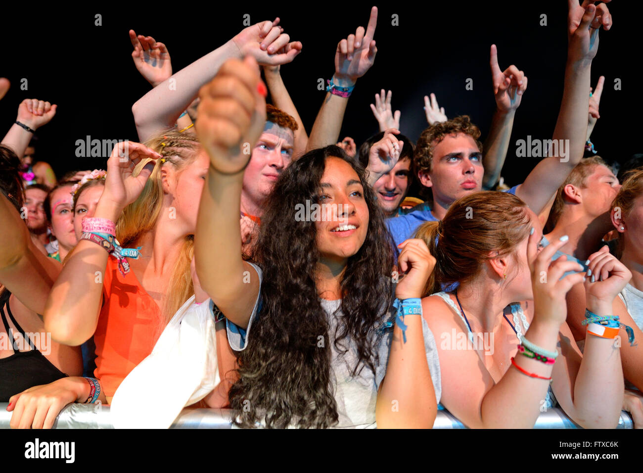 BENICASSIM, SPAIN - JULY 17: Crowd in a concert at FIB Festival on July 17, 2014 in Benicassim, Spain. Stock Photo