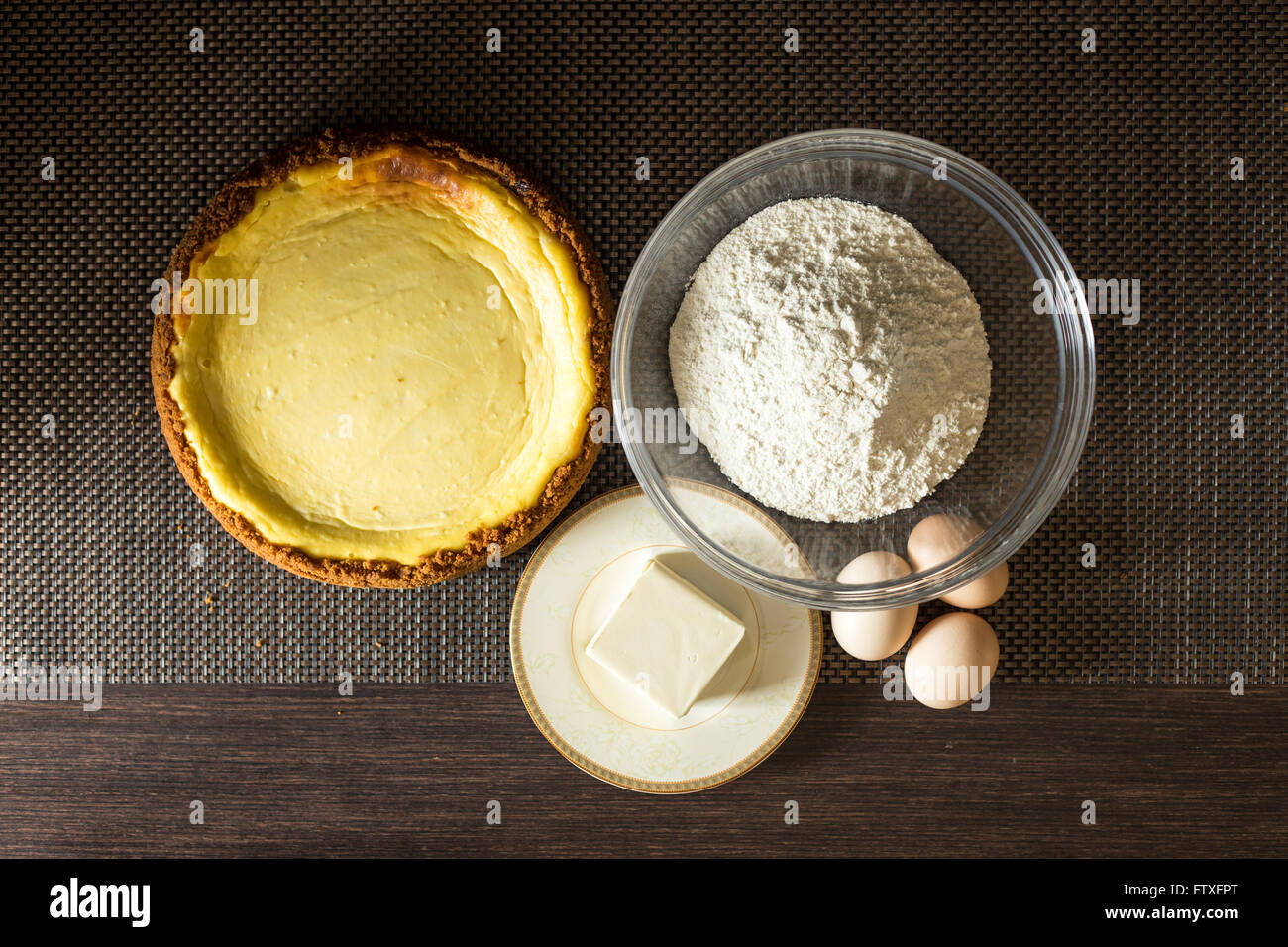 Homemade cake with ingredients around. Top view image of bakery culinary background Stock Photo