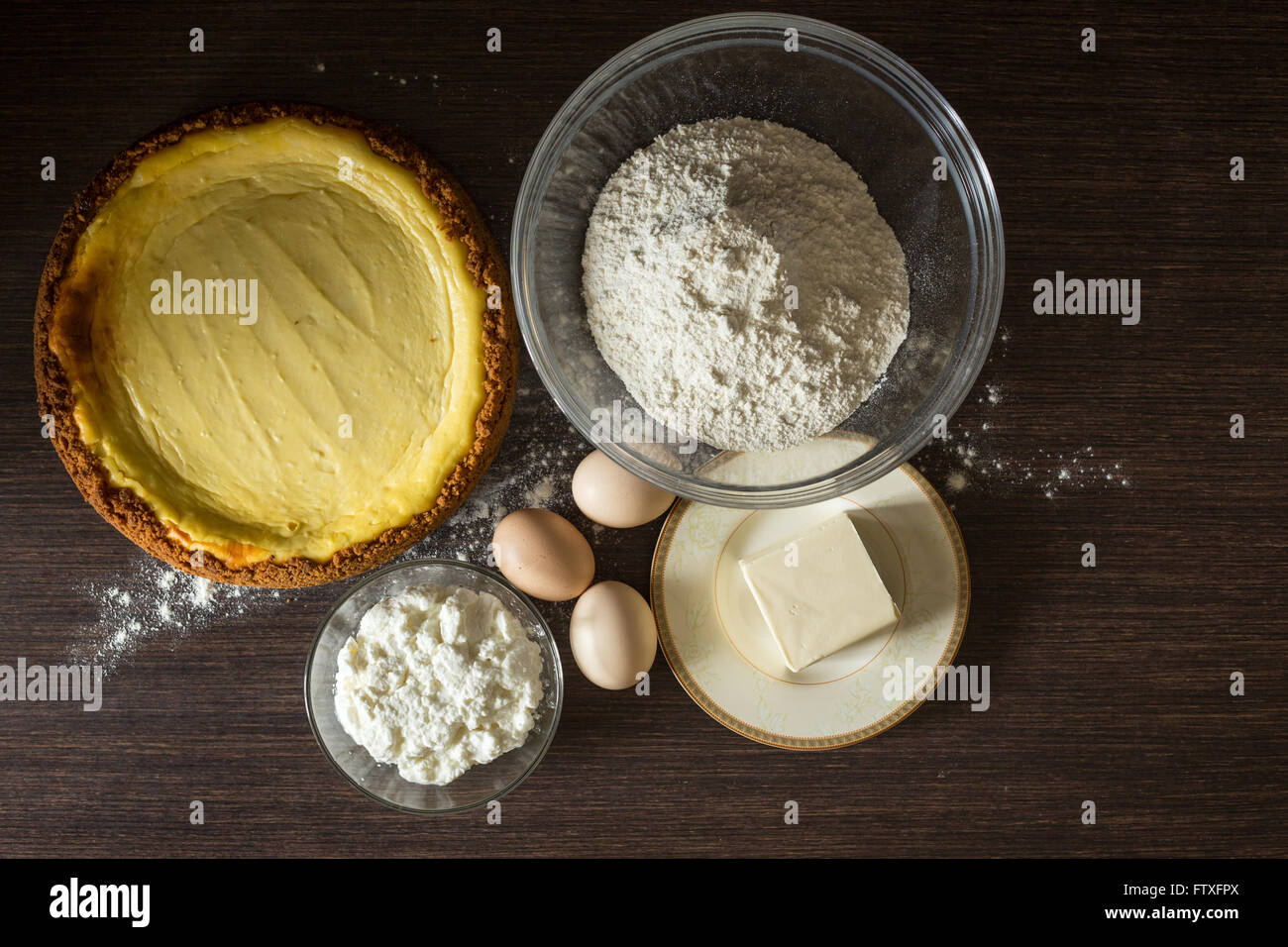 Homemade cheesecake with ingredients around. Bakery culinary background