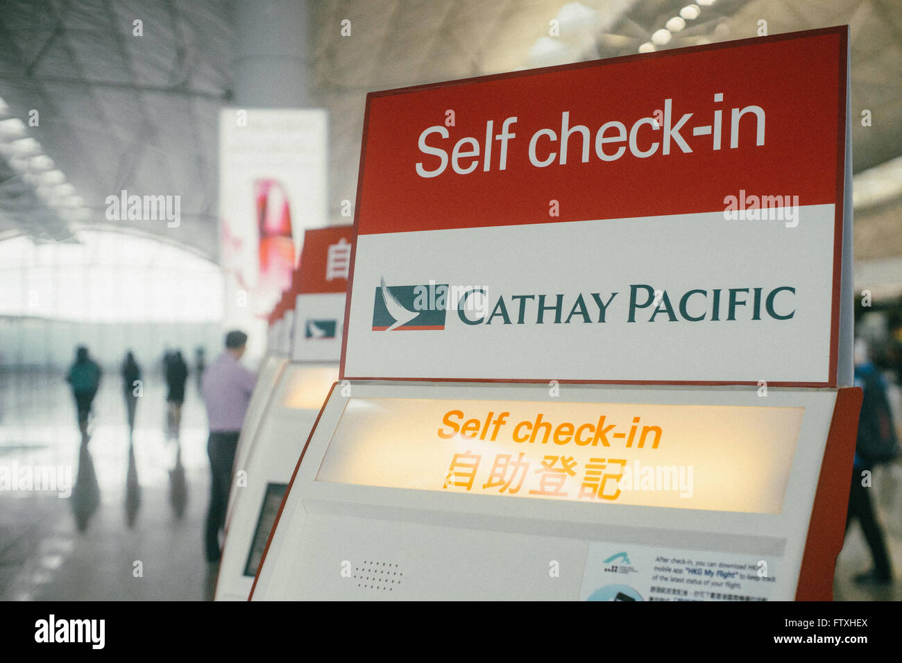 Cathay pacific self check in counter in hong kong airport. Stock Photo
