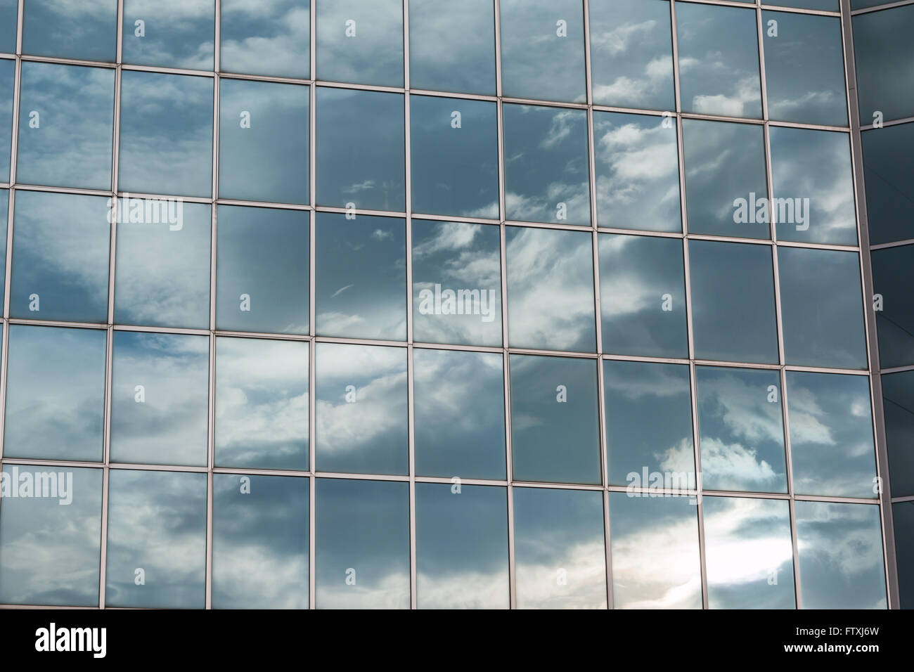 Blue Sky and Clouds Reflected in the Glass Building Stock Photo - Alamy