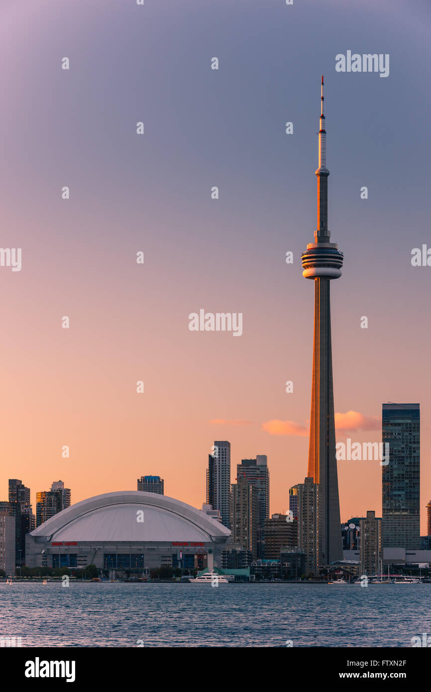Famous Toronto Skyline with the CN Tower and Rogers Centre at sunset taken from the Toronto Islands. Stock Photo
