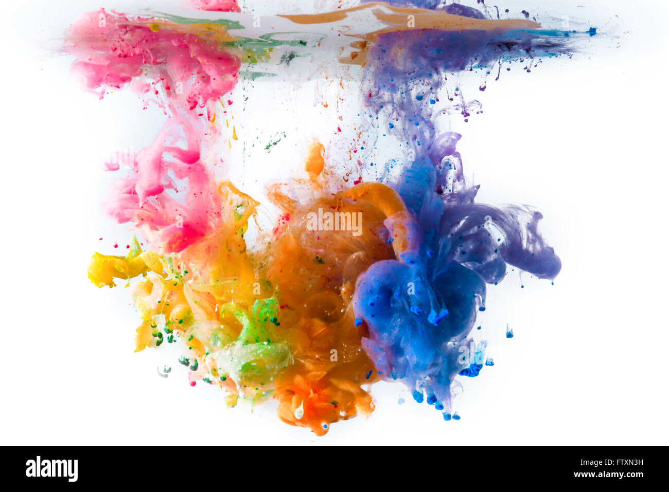 Multi-colored acrylic paints dissolving in water Stock Photo