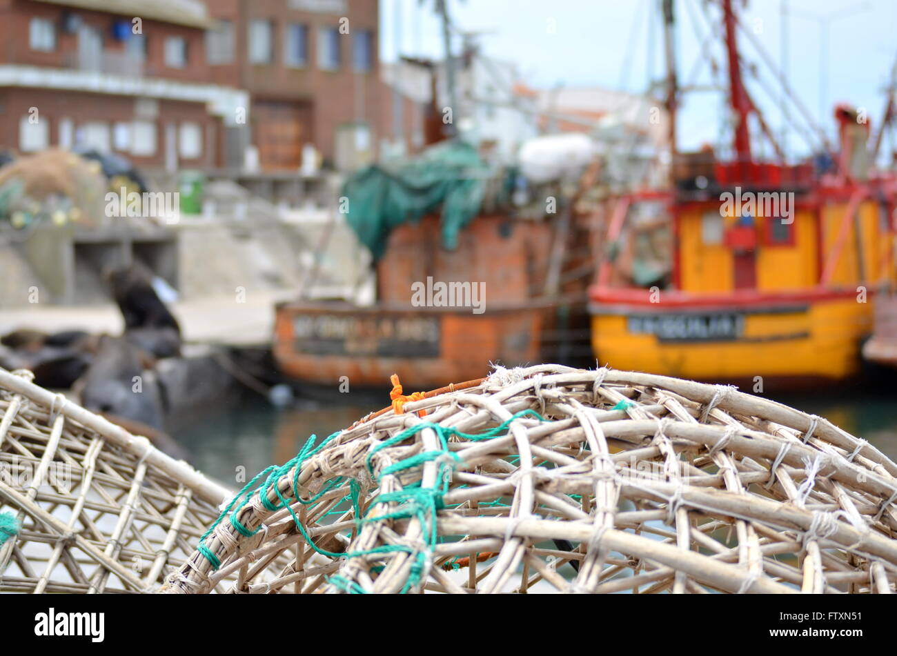 fishing basket traps and boats in the port of Mar del Plata, Argentina Stock Photo