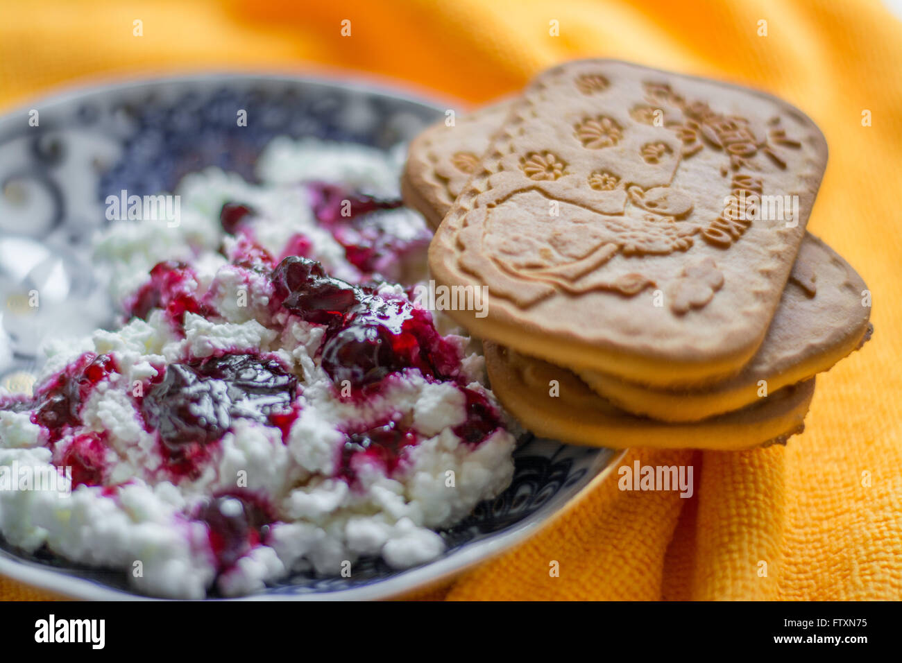 Cottage cheese with blueberry jam and mint for breakfast Stock Photo